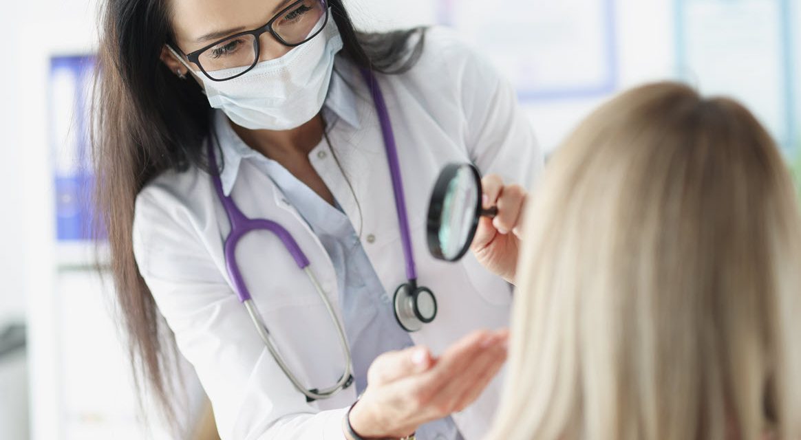 Female provider examining skin